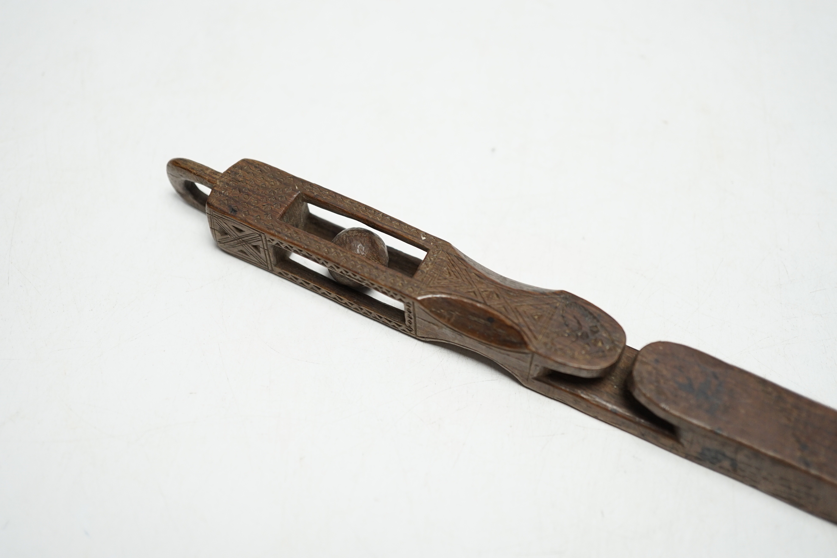 An 18th century carved wood love token, probably Welsh, 21.5cm